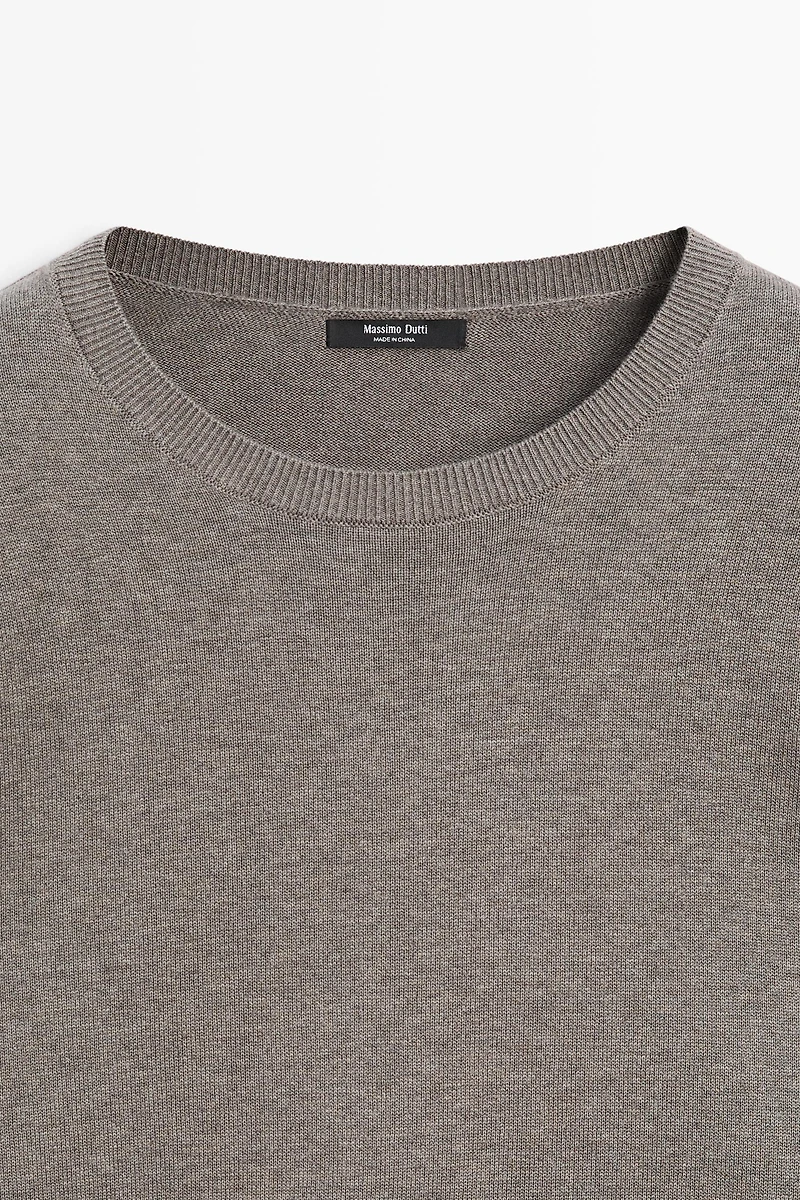 Oversize knit sweater with double sleeve detail
