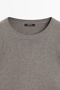 Oversize knit sweater with double sleeve detail