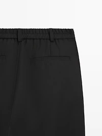 Relaxed fit wool trousers with dart detail