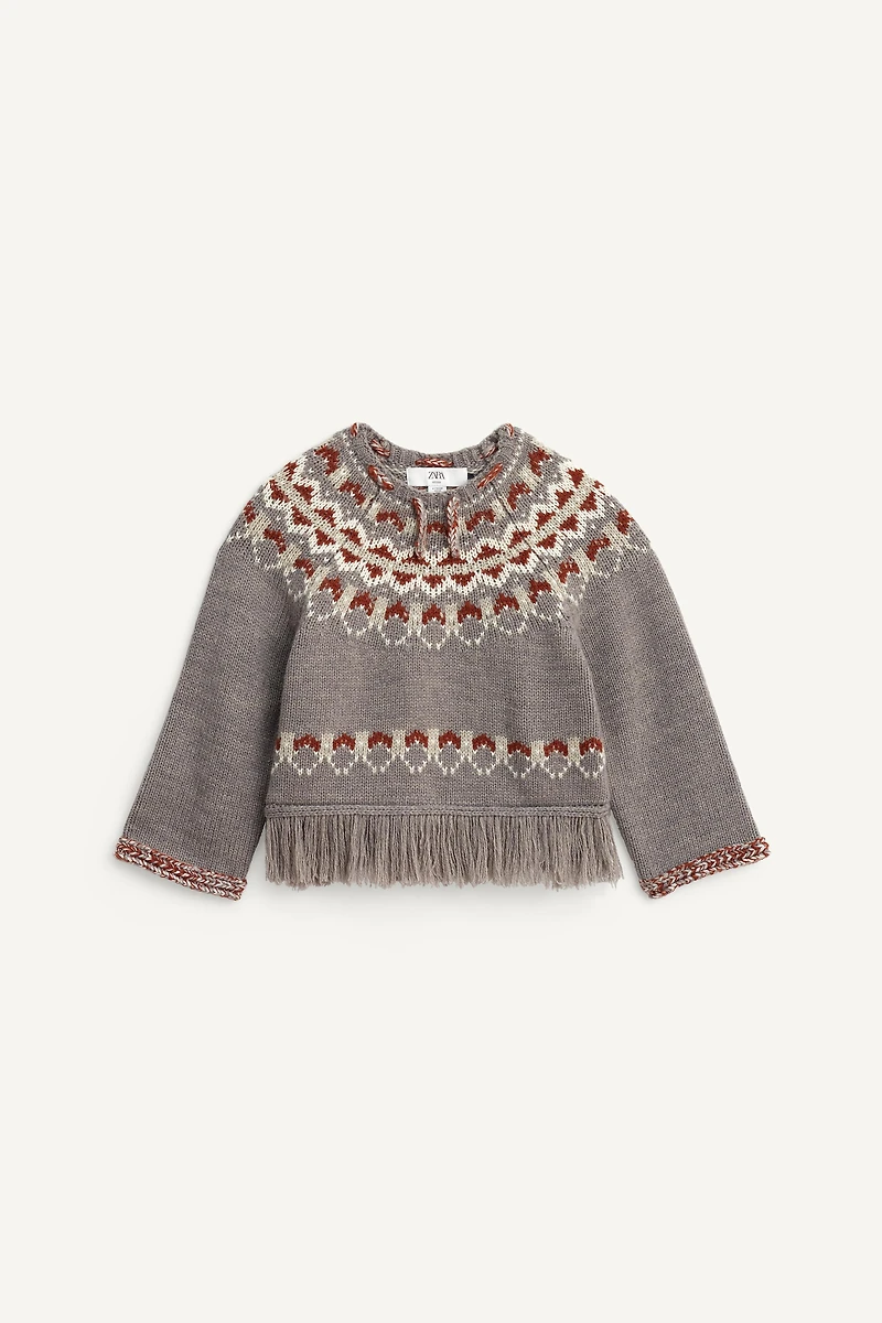 PULL PONCHO À FRANGES AVEC LAINE ÉDITION LIMITÉE