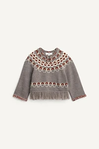PULL PONCHO À FRANGES AVEC LAINE ÉDITION LIMITÉE
