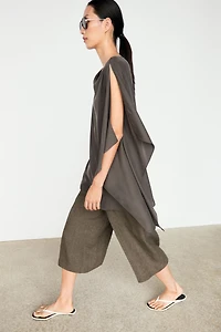 Asymmetric flowing cape top