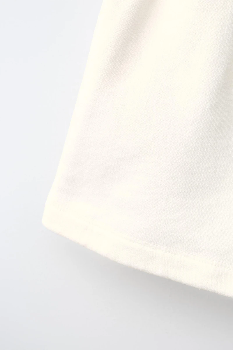 CONTRAST PIPING TEXT SHORTS