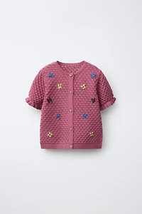 GILET EN MAILLE À FLEURS BRODÉES