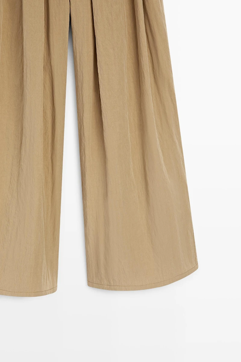 Pantalon palazzo à plis