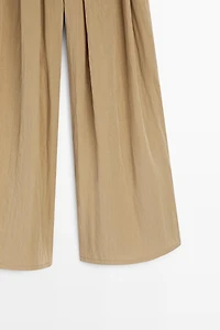 Pantalon palazzo à plis