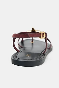 STRAPPY SANDALS WITH METALLIC DETAIL