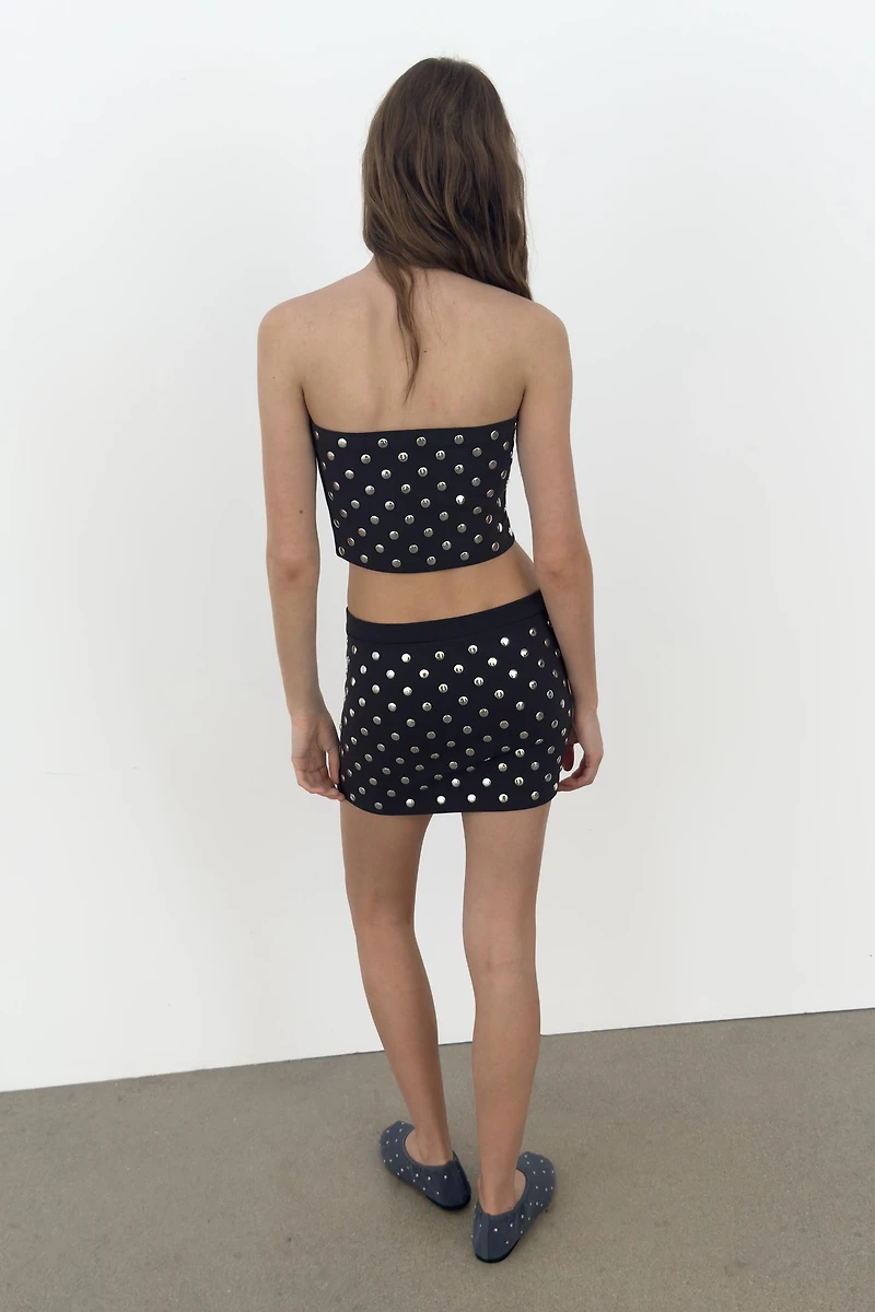 MINI JUPE À CLOUS