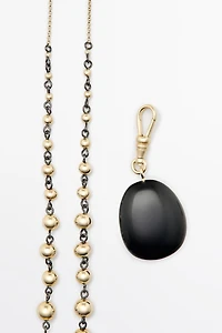 Beaded chain necklace with onyx piece
