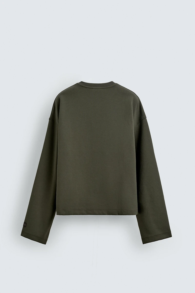 INTERLOCK CROPPED FIT SWEATSHIRT