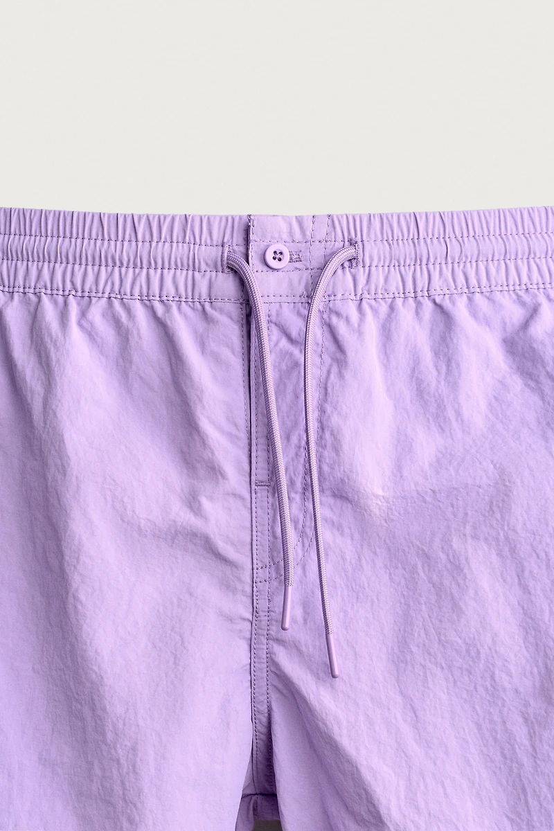 MID-LENGTH SWIMSUIT WITH VENTS