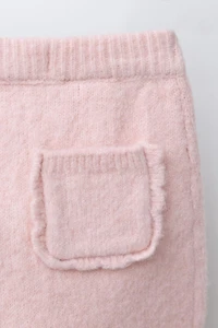 KNIT LEGGINGS WITH POCKET AND RUFFLES