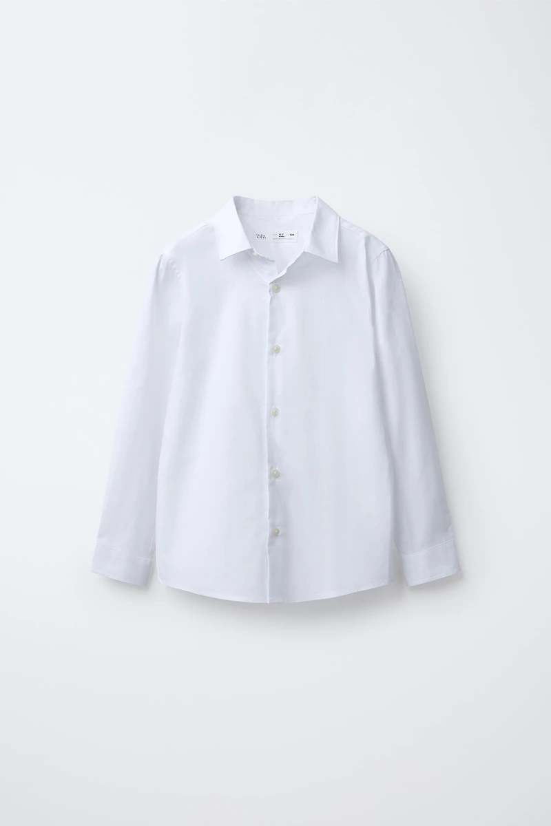 CHEMISE UNIE HABILLÉE