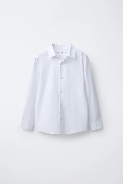 CHEMISE UNIE HABILLÉE