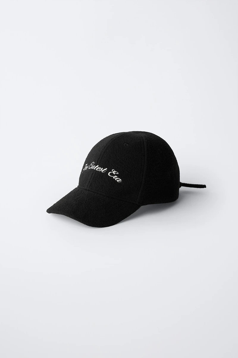 FABRIC CAP WITH BOW CLOSURE