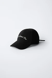 FABRIC CAP WITH BOW CLOSURE