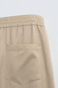 PANTALON BALLON FIT À PLIS