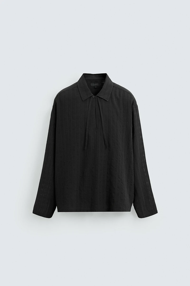 CHEMISE POLO STRUCTURÉE SEMI-TRANSPARENTE