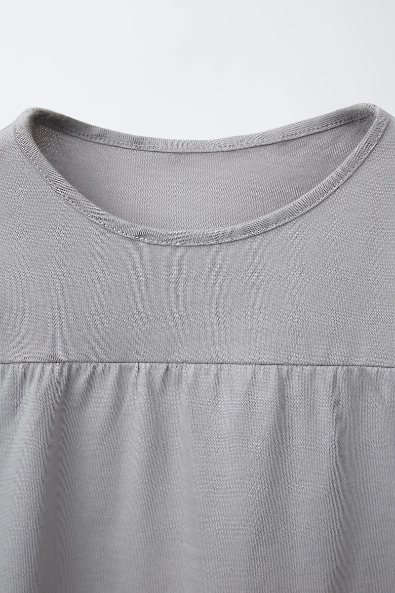 T-SHIRT UNI À VOLANTS