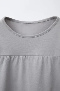 T-SHIRT UNI À VOLANTS