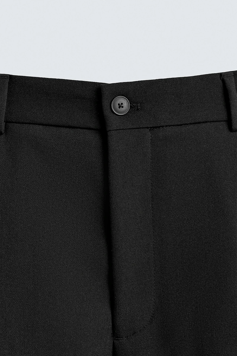 RELAXED FIT PLEATED PANTS