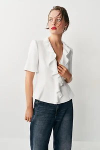 VESTE À MANCHES COURTES ET VOLANTS