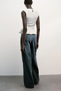 TOP PÉPLUM BOUCLE À