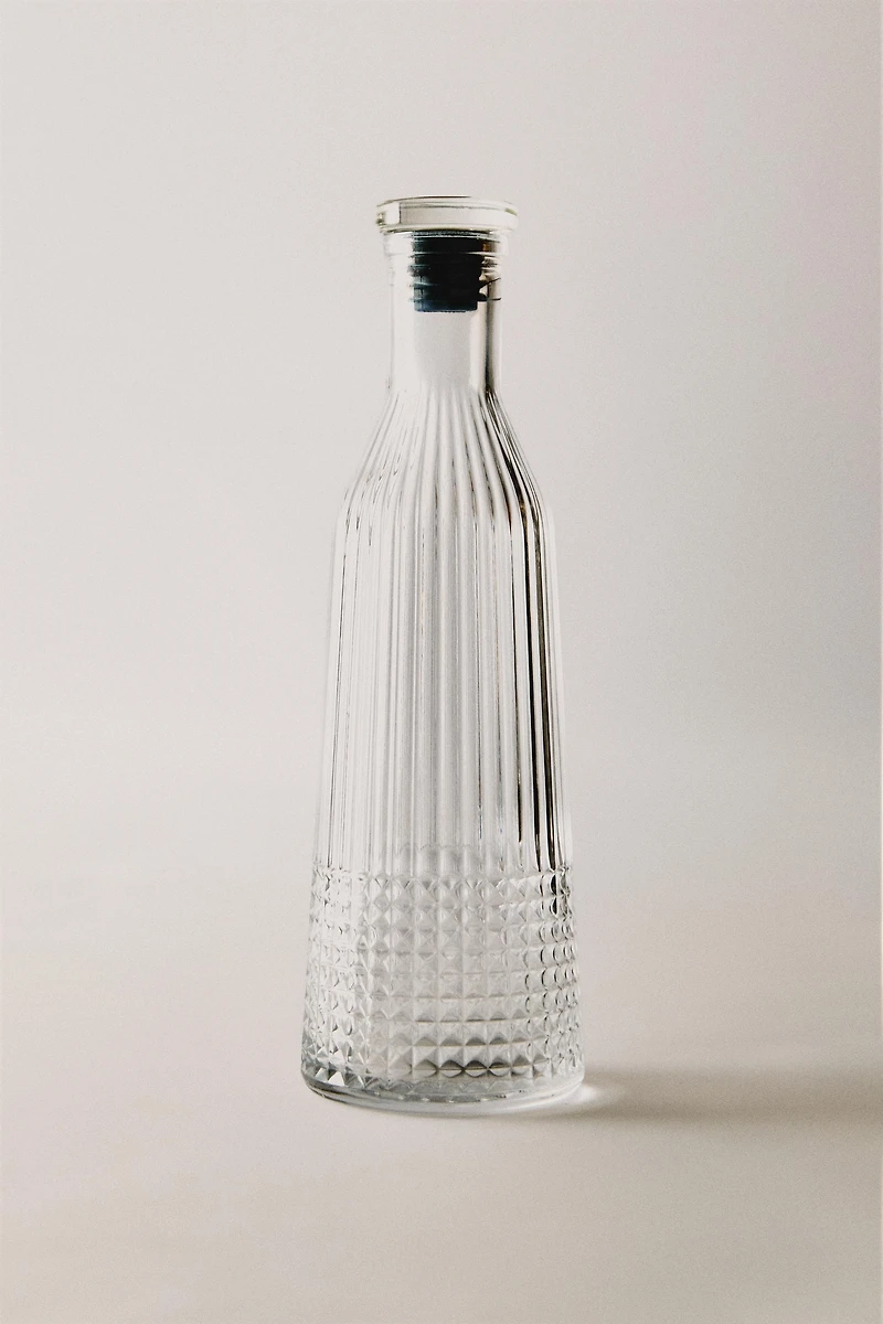 RAISED DESIGN GLASS BOTTLE