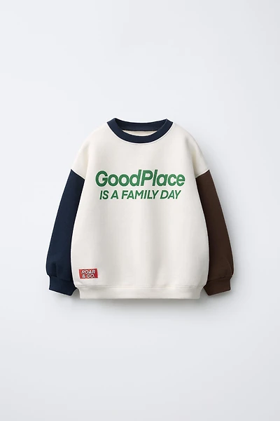 TEXT RAGLAN SLEEVE SWEATSHIRT