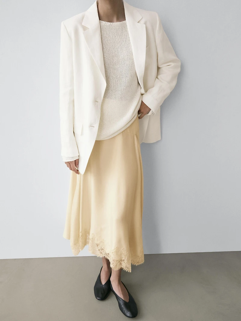 Asymmetric skirt with lace-trimmed detail