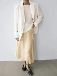 Asymmetric skirt with lace-trimmed detail