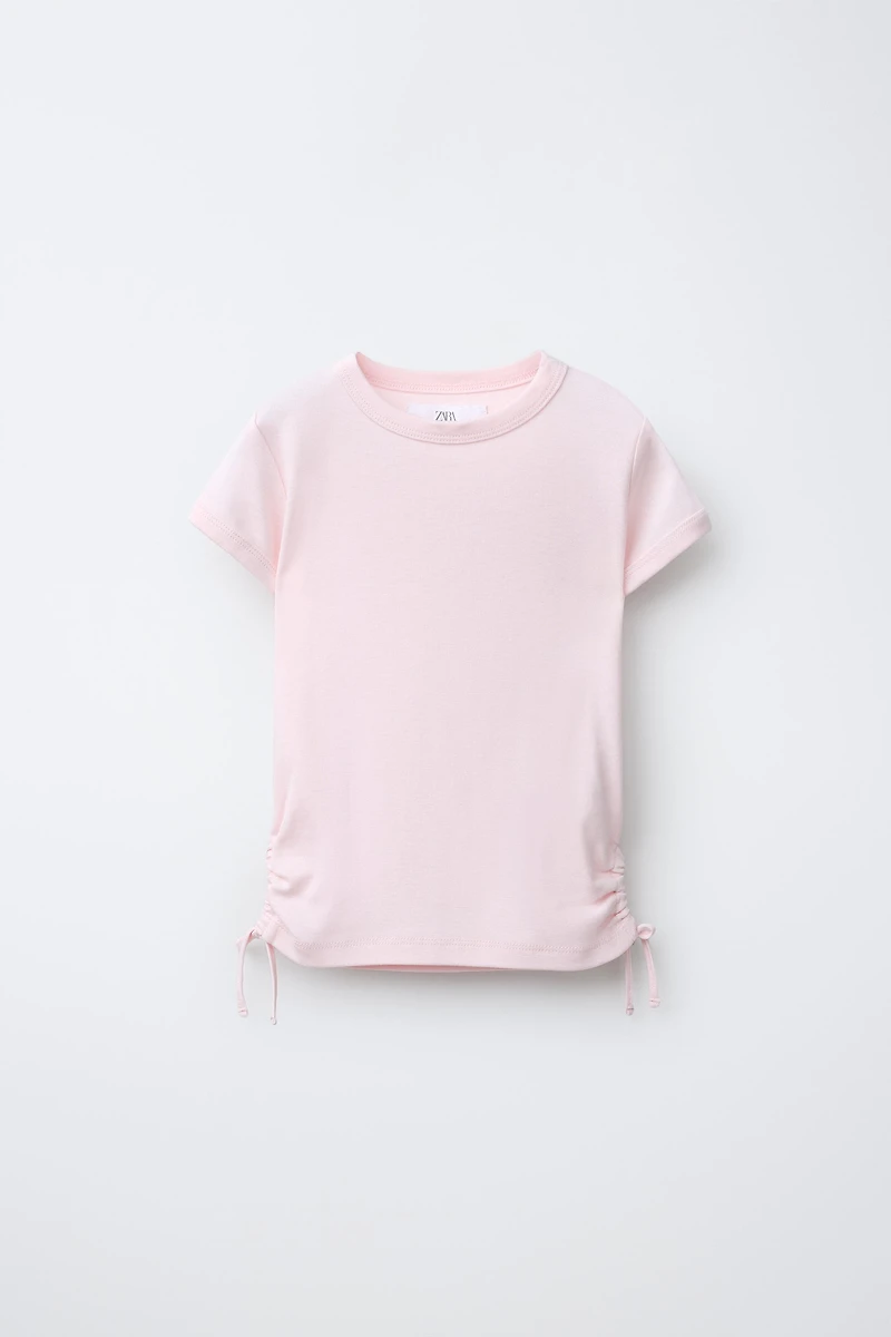 MODAL T-SHIRT WITH CUT OUTS AND BOWS