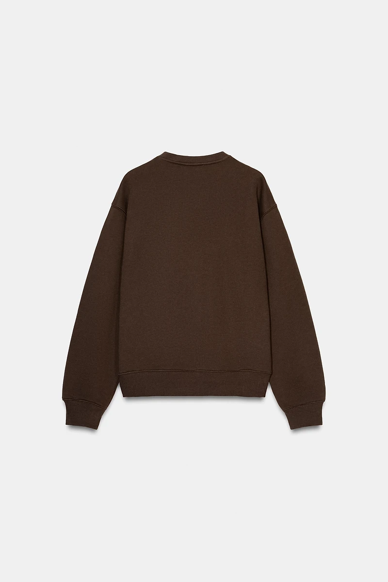 EMBOSSED BOW SWEATSHIRT