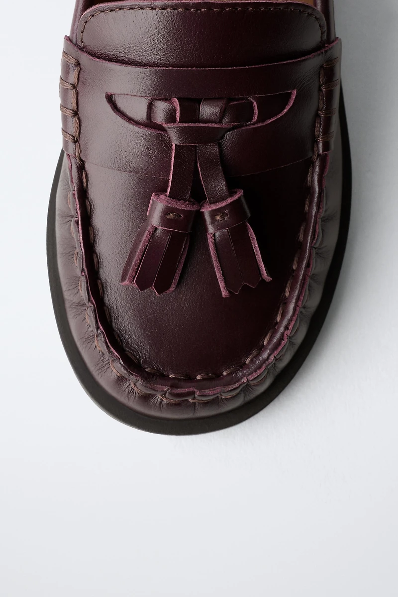 MOCASSINS À POMPONS EN CUIR LIMITED EDITION