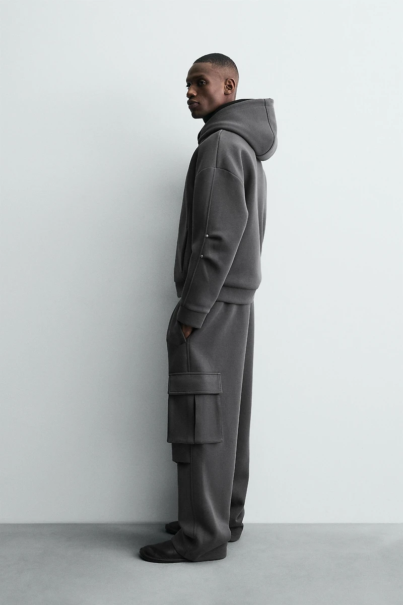 NEOPRENE EFFECT CARGO PANTS WITH PLEATS