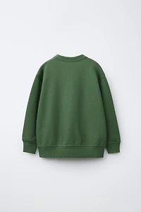 RAISED TEXT SWEATSHIRT