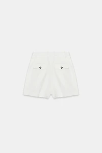 HIGH-WAISTED PLEATED SHORTS