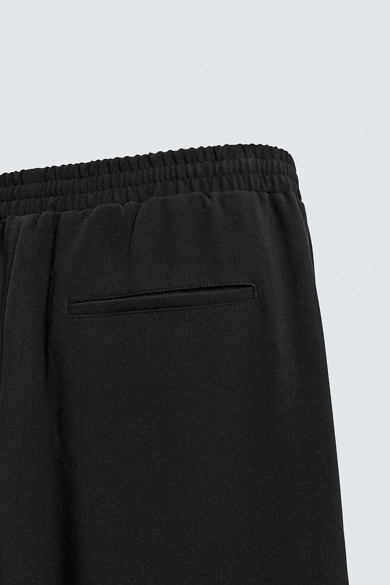 FLOWY ZIPPERED PANTS