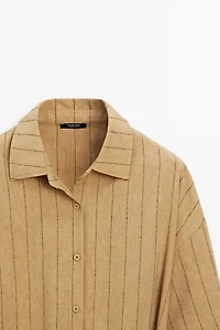 Striped flowing shirt with corset belt detail