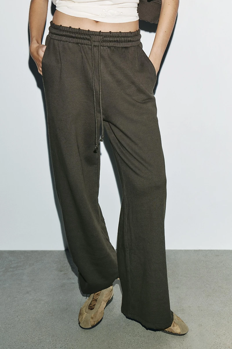 PANTALON LAVÉ ÉTOILES CLOUS