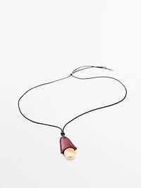 Pendentif pièce en cuir