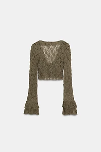 VESTE COURTE EN DENTELLE À VOLANTS