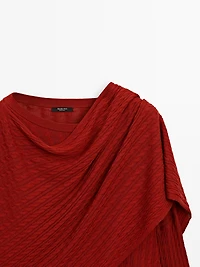 Cable-knit sweater with scarf detail