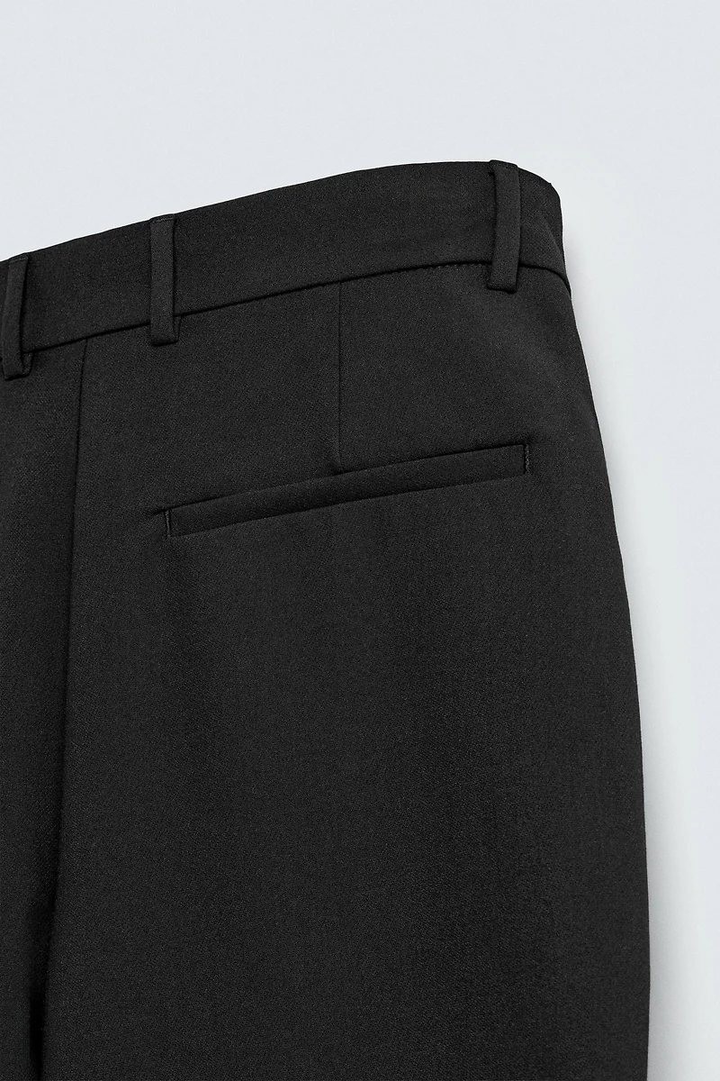 RELAXED FIT PLEATED PANTS