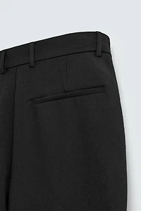 RELAXED FIT PLEATED PANTS
