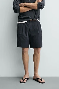 REGULAR FIT PLEATED CHINO SHORTS