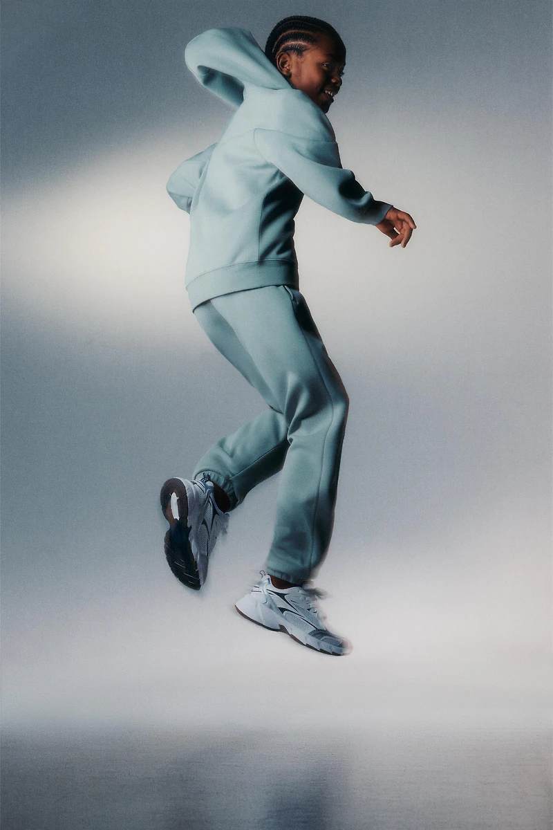 SPORTY JOGGER PANTS WITH RUBBERIZED LABEL