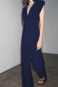 LONG DRAPED SHOULDER PAD JUMPSUIT