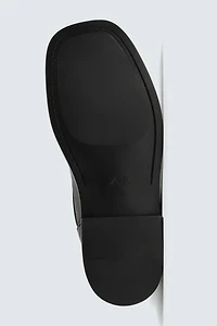 BOTTES EN CUIR À BOUCLES