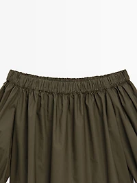 Voluminous boat neck top